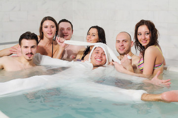 Three girls and three guys having fun in the pool