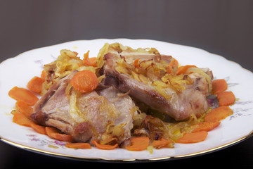 Plate of stew meat on the table