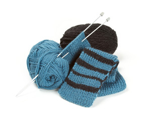 striped scarf on knitting needles