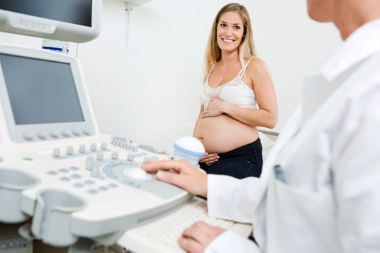 Pregnant Woman Looking At Obstetrician