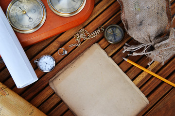 compass, watch and old paper