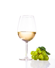 wineglass with white wine and grape