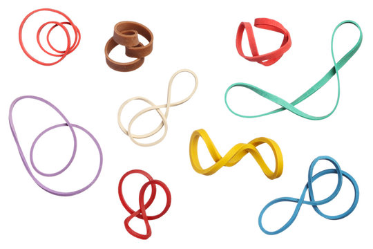 Twisted colorful elastic rubber bands isolated on white backgrou