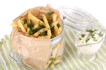 French fries in bank on napkin isolated on white