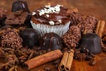 Tasty cupcake with different sweets close up