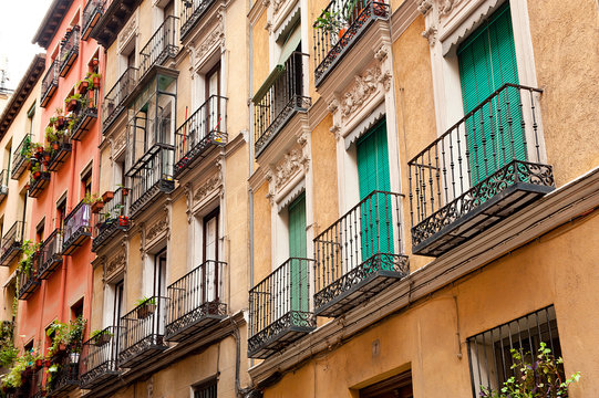 Spanish balconies at buildings facade in Madrid