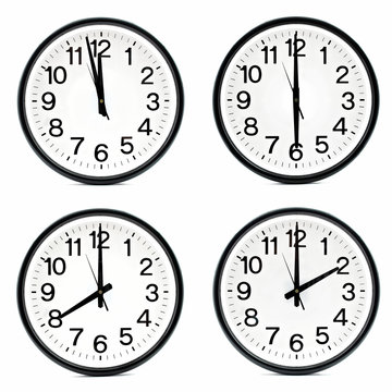 Group of wall clocks isolated on white background