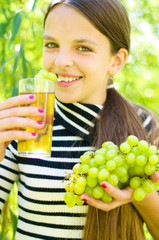 Girl holding grapes