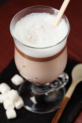 Making hot chocolate with chocolate on stick