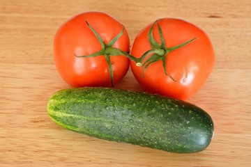 Two tomatoes and a cucumber