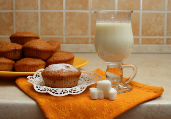 Cake on a plate with a glass of milk