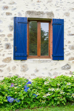 French window with shutters