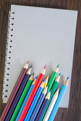 color pencils and note