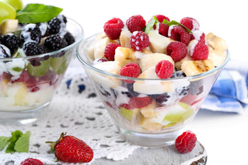 Fruit salad in glass bowls, isolated on white