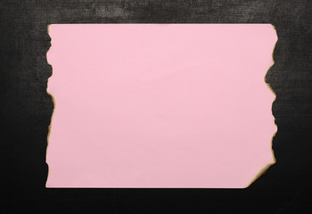 Purple Burnt Paper On Chalkboard