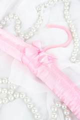 Beautiful hanger on fabric background