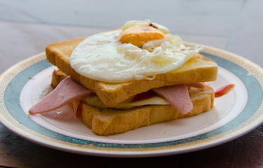 fried egg and ham sandwich on toast.