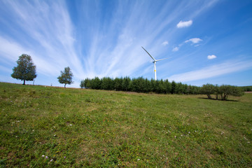 Fototapeta na wymiar wind power generator on the grassland