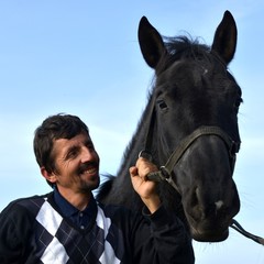 Fototapeta premium A young man with a horse.