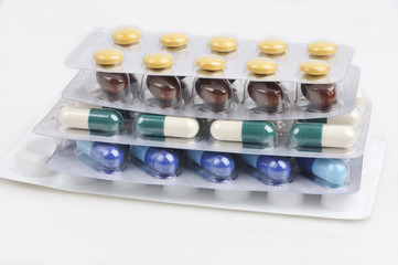 assortment of pills and capsules in blister