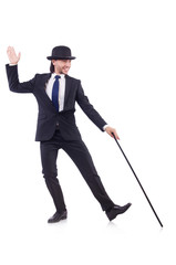 Man dancing with walking stick on white