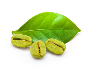 Green coffee beans with leaf on white background.