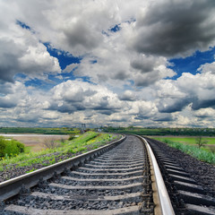 Fototapeta premium dramatic sky and railroad to horizon