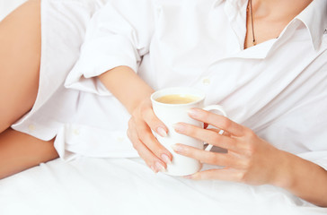 Women's hands with a cup of coffee