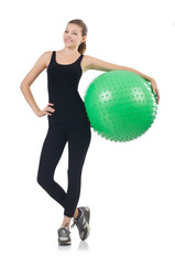 Fototapeta premium Young woman with ball exercising on whitee