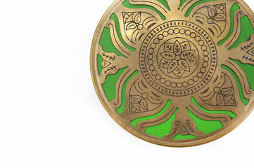 Green circle with gold ethnic ornament