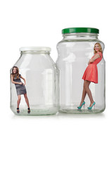 Woman in glass jar isolated on white