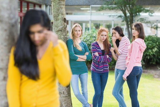 Student being bullied by a group of students