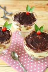 three tiramisu dessert on wooden table