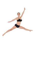 Fototapeta na wymiar Sporty woman jumping on white background