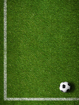 Soccer grass field with marking and ball top view