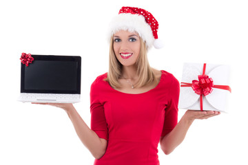 young woman in santa hat holding notebook and present over white