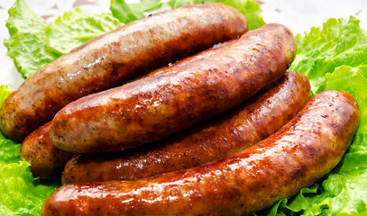 Frying pork sausages