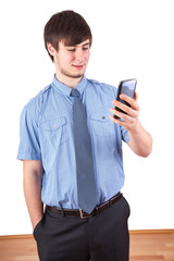 Young businessman looking at his smartphone