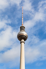 Obraz premium TV tower spire with blue cloudy sky