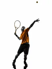 Fotobehang man tennis player at service serving silhouette © snaptitude