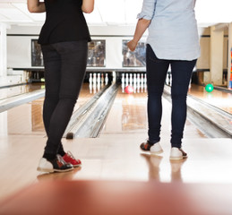 Fototapeta premium Female Friends Bowling in Club
