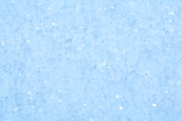 Blue sparkling snow background.