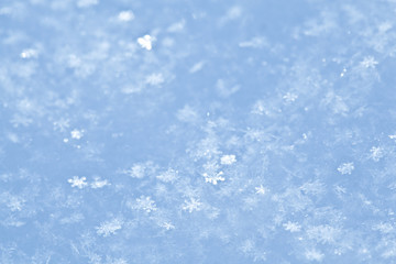 Blue sparkling snow background.