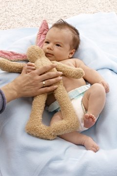 Lovely infant with plush bunny