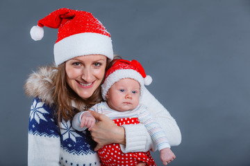 Portrait of happy family in Santa's hat