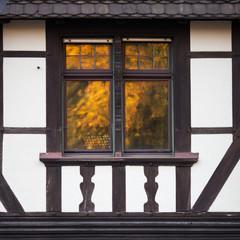 window reflection in half timbered house