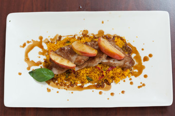 Overhead view of couscous dish with meat