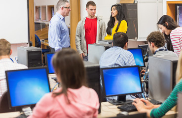 Teacher and students in the computer room