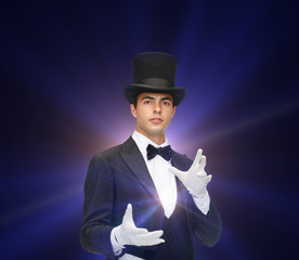 magician in top hat showing trick