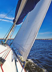 Sailboat in action, extreme sport, autumn cruise on the lake, ac
